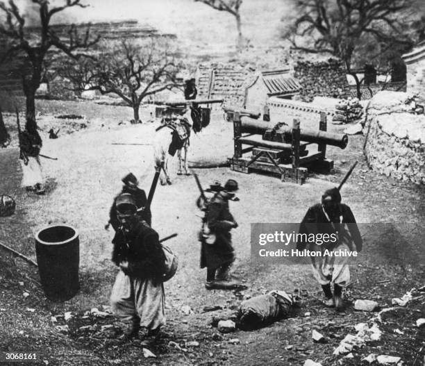French Zouaves inspecting a battle position near the Great Wall of China during the Boxer rebellion.