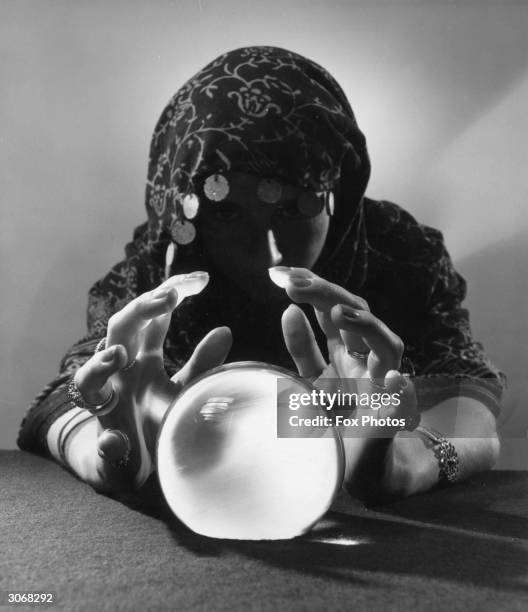 Gypsy fortune-teller gazing into her crystal ball.