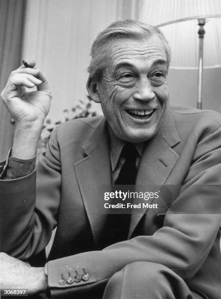 American film director John Huston in his hotel suite at Claridges, London. His prodigious resume includes such movie classics as 'The Treasure of...