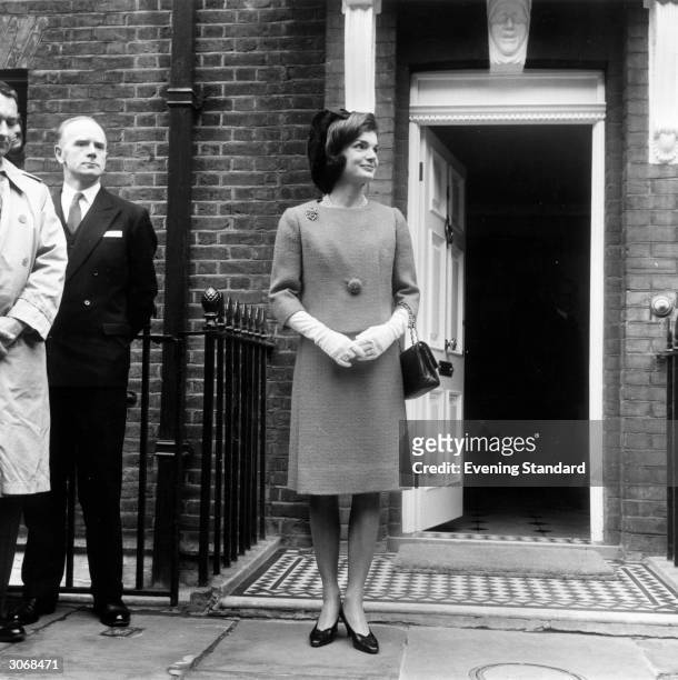 Jackie Kennedy , leaving for lunch with Queen Elizabeth II of Great Britain.