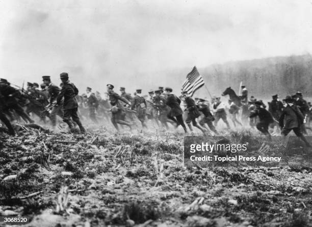 American troops preparing for WW I on a mock battlefield.