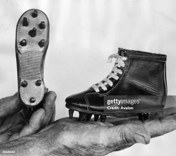 Mini football boots measuring only six inches long designed by Carl Vaugn of St Petersburg, Florida who belives in starting the sport young.