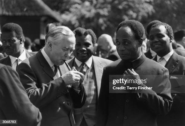 Lighting his pipe, British Prime Minister Harold Wilson and on the right, Dr Kwame Nkrumah Prime Minister of Ghana at a Commonwealth Prime Ministers...