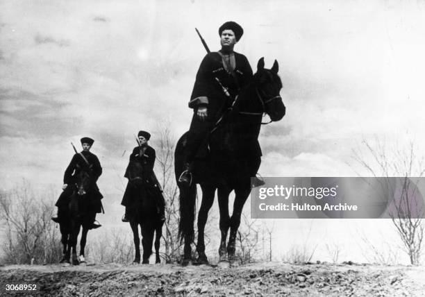 Armed Cossacks on their ponies during WW II.