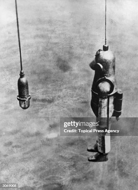 Diver goes down from the salvage ship 'Blakey' to the wreck of the British schooner Cape Horn off the coast of Chile to recover a cargo of sunken...