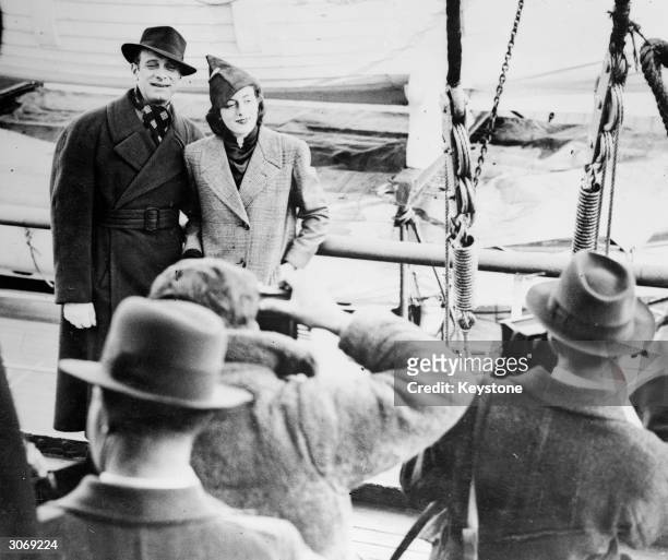 British broadcaster and comedian Vic Oliver with his wife Sarah Churchill aboard the Aquitania at Southampton.