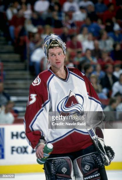 Goaltender Patrick Roy of the Colorado Avalanche in action during a game against the Calgary Flames at the McNichols Arena in Denver, Colorado. The...