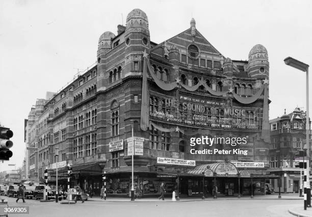 The Palace Theatre on Cambridge Circus, London advertises its fourth year of the Rodgers and Hammerstein hit musical 'The Sound of Music'.