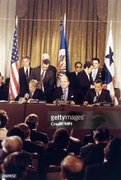 Jimmy Carter, the 39th President of the United States and President Omar Torrijos Herara of Panama signing the Panama Canal Treaty.
