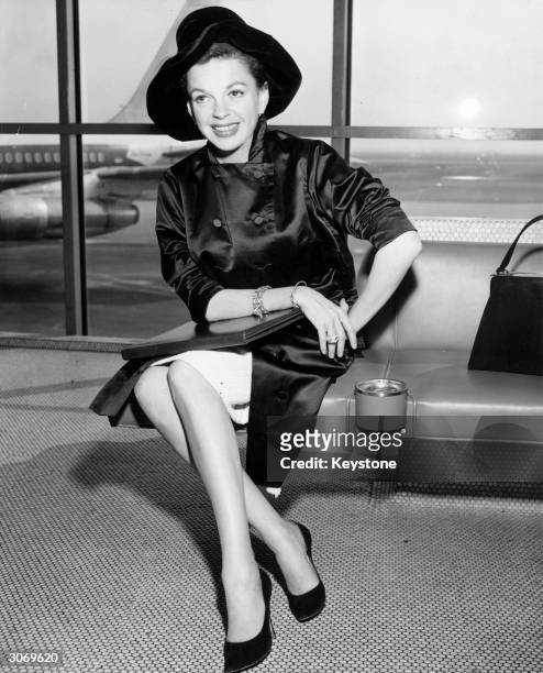 Singer and film star, Judy Garland at an airport.