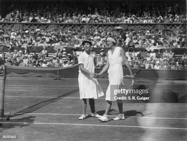 Cilly Aussem being congratulated by Hilde Krahwinkel on winning the women's singles at Wimbledon in an all German final.