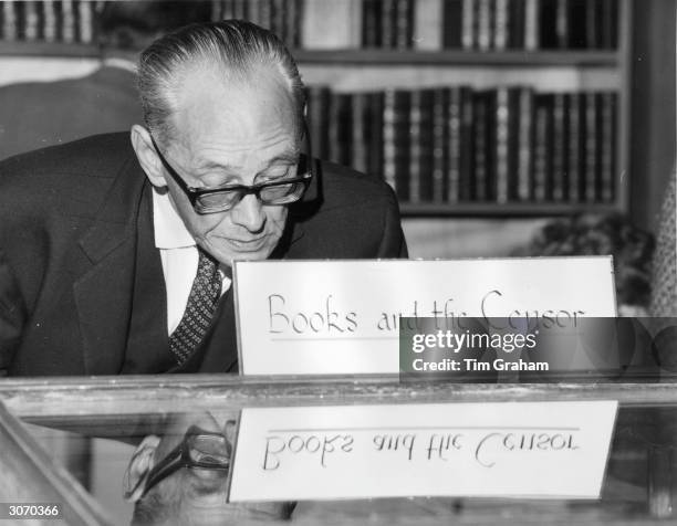 Visitor at an exhibition of banned books on show at the Book Collectors Fair held at the National Book League, Albemarle St, London.