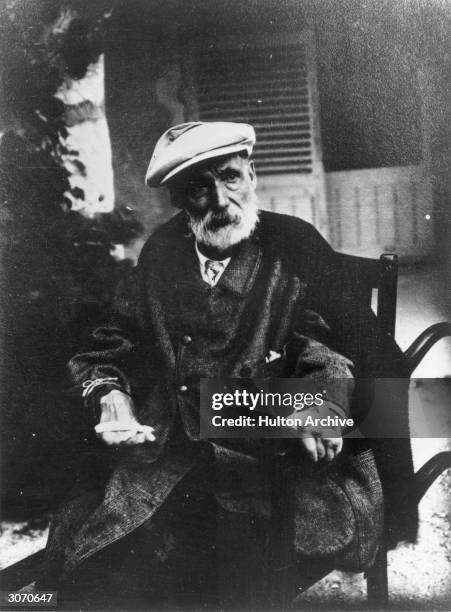 Impressionist painter,Pierre Auguste Renoir at his home, Les Collettes, Cagnes, France. His hands are crippled with arthritis.