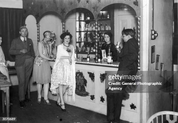 Flappers at the bar of Isa Lanchester's night club in London.