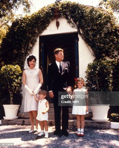 John Fitzgerald Kennedy , the 35th President of the United States, with his wife Jacqueline and their children Caroline and John Jnr on Easter Sunday...