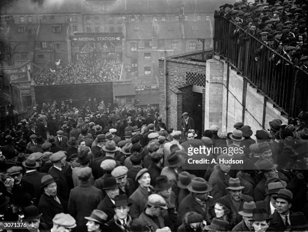 Spectators in the crush at Highbury ground in London when a huge crowd turned up for the Arsenal versus Tottenham Hotspur match.