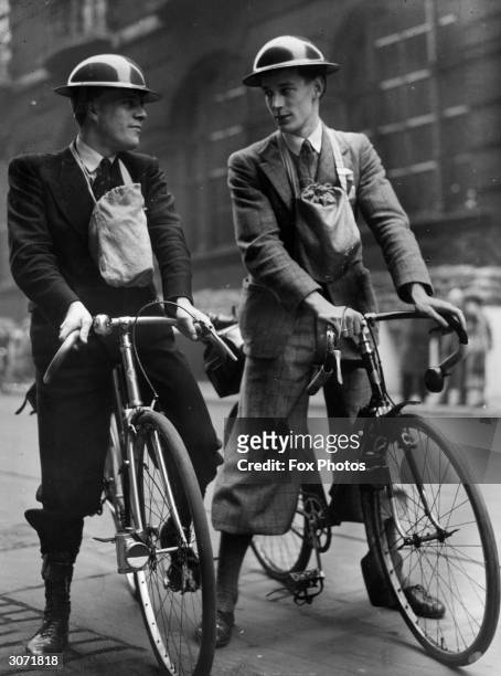 Champion of the Mersey Road Club R C Coward and the Liverpool Trials Champion E Murstill volunteer for the new corps of cyclist ARP messengers.