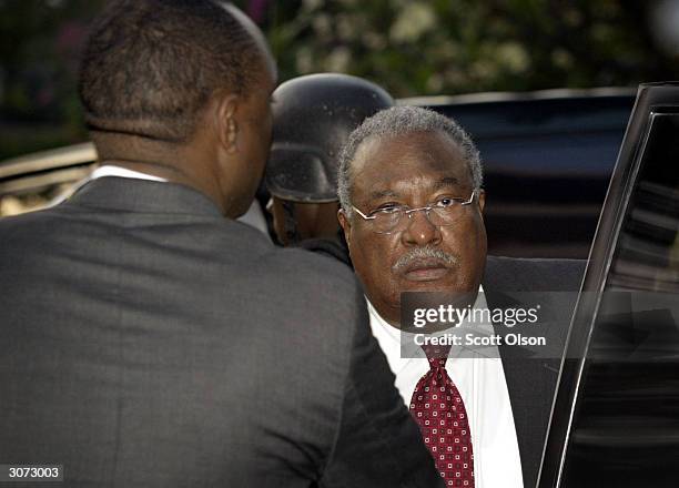 Gerard Latortue, newly appointed prime minister of Haiti, arrives at a hotel March 10, 2004 in Port-au-Prince, Haiti. Latortue replaces Yvon Neptune...