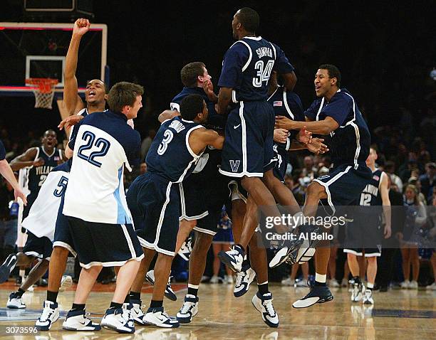The Villanova Wildcats celebrate their 61-60 victory over of the Seton Hall Pirates during their first round game of the Big East Championship...