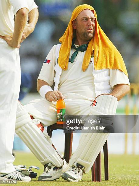 Darren Lehmann of Australia feels the heat during day four of the First Test between Australia and Sri Lanka played at the Galle International...
