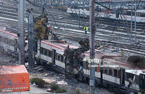 The wreckage of a commuter train is seen March 11, 2004 after it was devastated by a bomb blast during the morning rush hour in Madrid, Spain....