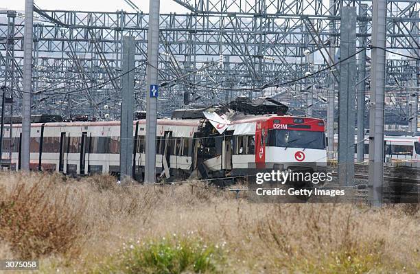 The wreckage of a commuter train is seen March 11, 2004 after it was devastated by a bomb blast during the morning rush hour in Madrid, Spain....