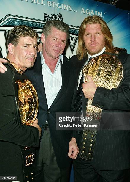 Wrestler Eddie Guerrero, WWE Chairman Vince McMahon and Wrestler Triple H attend a press conference to promote Wrestlemania XX at Planet Hollywood...
