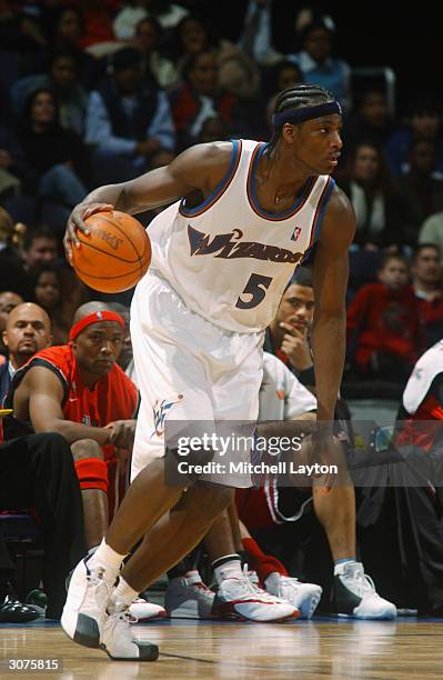 Kwame Brown of the Washington Wizards moves the ball during the game against the Chicago Bulls at the MCI Center on February 26, 2004 in Washington,...