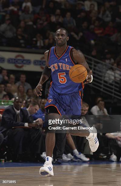 Tim Thomas of the New York Knicks drives against the Denver Nuggets during the game at Pepsi Center on February 29, 2004 in Denver, Colorado. The...