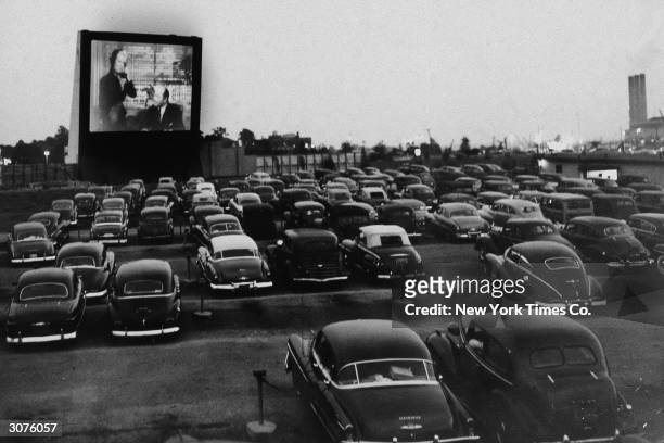 People watch an unidentified movie from inside their cars at the Whitestone Bridge Drive-in Movie Theater, the Bronx, New York, June 20, 1951.