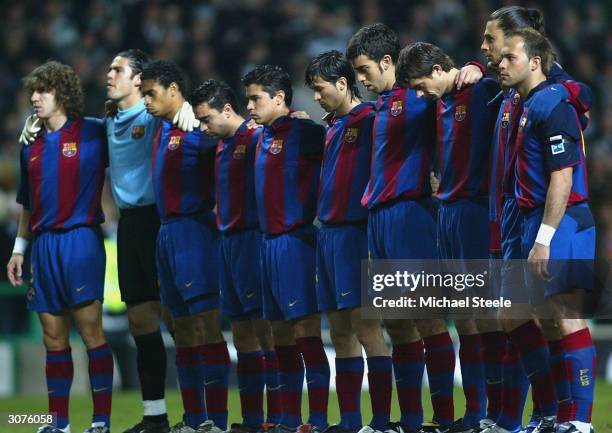 Barcelona players line up for a minuites silence for the victims of the commuter train terrorist attacks in Madrid before the UEFA Cup Fourth Round,...