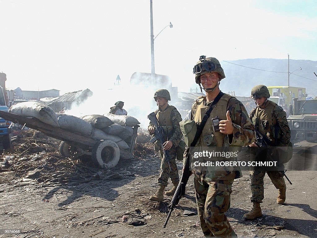 A US Marine gives the thumbs up sign as
