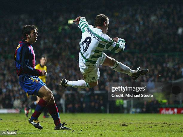 Alan Thompson of Celtic scores the first goal during the UEFA Cup Fourth Round, First Leg match between Celtic and Barcelona at Celtic Park on March...