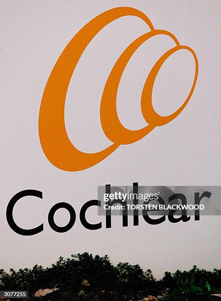 Photo taken 26 July 2002, shows Australian biotechnology company Cochlear's logo outside their Sydney corporate headquarters. Shares in Australian...