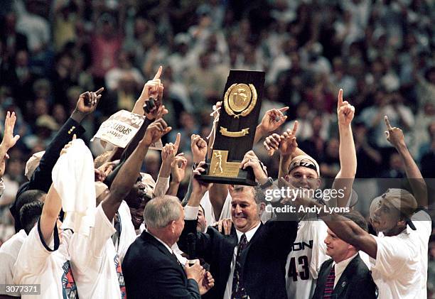 The UConn Huskies celebrates as head coach Jim Calhoun holds up the trophy after the NCAA Championship game against Duke University Blue Devils at...