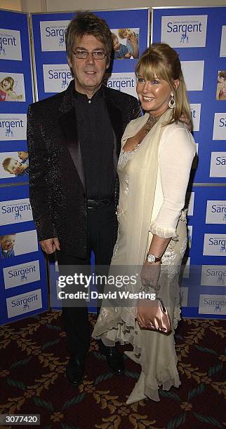 Mike Reid, of the reality television show "I'm A Celebrity Get Me Out Of Here,"and his wife arrive at The Chocolate Ball March 11, 2004 at Cafe Royal...