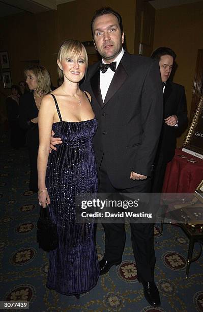 Neil Ruddock of the reality television show "I'm A Celebrity Get Me Out Of Here,"and his wife arrive at The Chocolate Ball March 11, 2004 at Cafe...