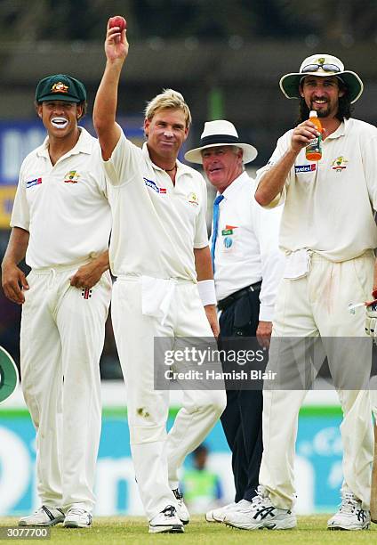 Shane Warne of Australia celebrates his 500th career wicket after dismissing Hashan Tillakaratne of Sri Lanka during day five of the First Test...
