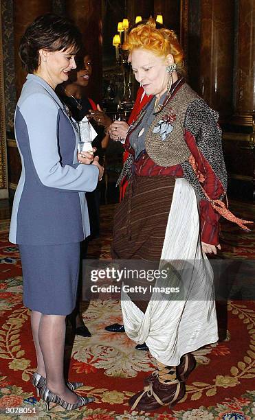 The British Prime Minister's wife Cherie Blair and fashion designer Vivienne Westwood talk during a reception to honour Britain's Women Achievers at...