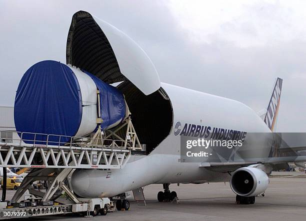 Picture taken in 2004 in Hamburg shows the EADS Airbus A300-600ST Beluga Super Trasporter unloading an A380 tailcone. The "Beluga", designed as a...