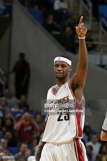 LeBron James of the Cleveland Cavaliers celebrates during the game against the Milwaukee Bucks at Gund Arena on March 6, 2004 in Cleveland, Ohio. The...