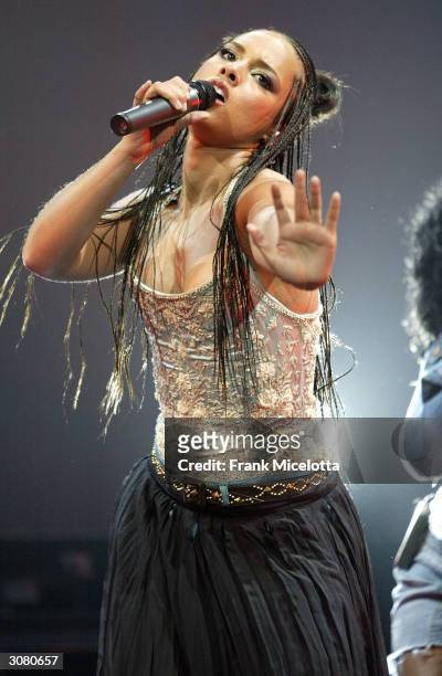 Singer/musician Alicia Keys performs onstage during the start of the "Verizon Ladies First Tour 2004" at the Office Depot Center March 12, 2004 in...