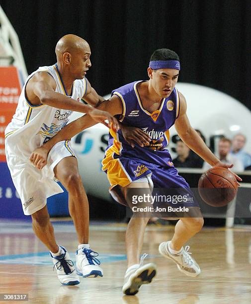 Luke Martin of the Kings holds off Derek Rucker of the Bullets during NBL match between Sydney Kings and Brisbane Bullets at Sydney Entertainment...