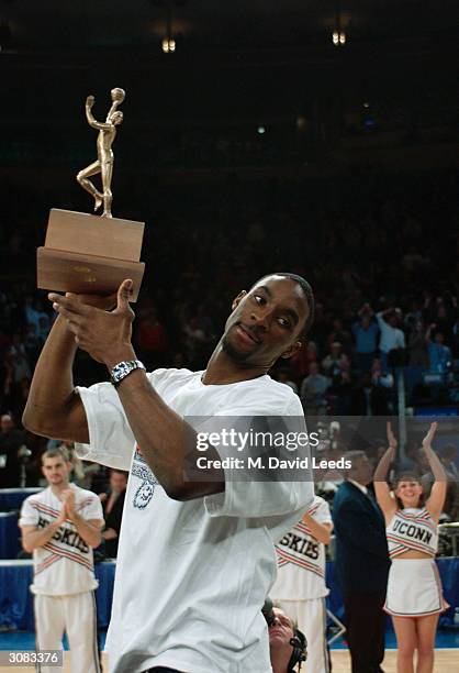 Ben Gordon of the Connecticut Huskies holds the tournament MVP trophy following his team's 61-58 victory over the Pittsburgh Panthers during the Big...