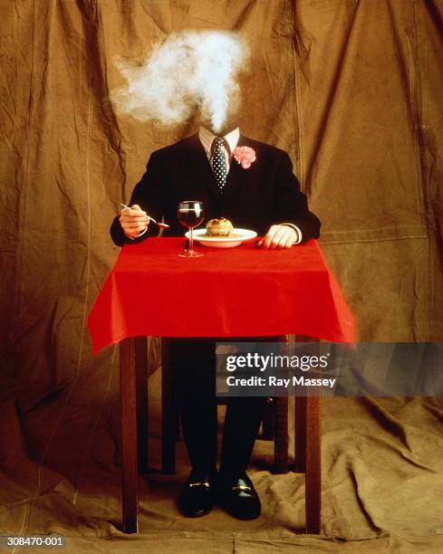 headless man in suit at table, about to eat soup with toad in - headless man 個照片及圖片檔