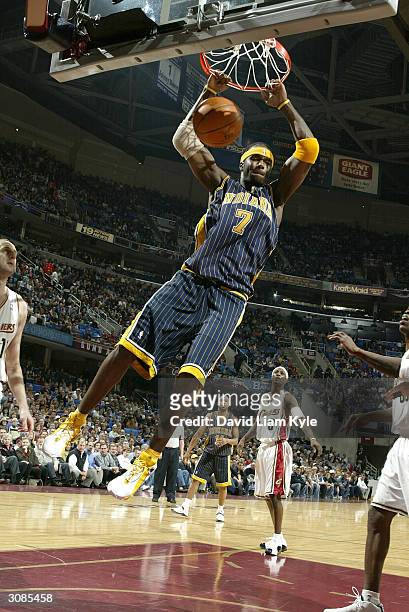 Jermaine O'Neal of the Indiana Pacers dunks against the Cleveland Cavaliers on March 14, 2004 at Gund Arena in Cleveland, Ohio. NOTE TO USER: User...