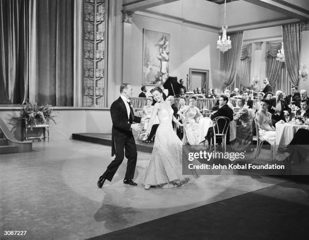 Fred Astaire and Ann Miller film a dance scene for the MGM film 'Easter Parade', directed by Charles Walters, 14th January 1948.