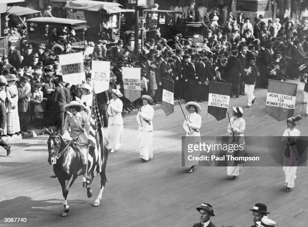 Grand Marshal Inez Milholland Boissevain leads a parade of 30,000 representives of the various Women's Suffrage associations through Washington DC.
