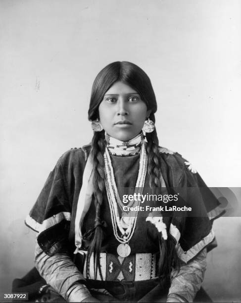Yakima woman wearing a traditional deerskin wingdress. The Yakima are Plateau Indians.