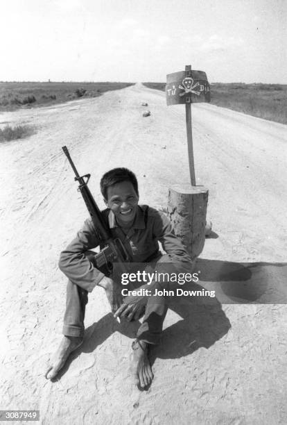 Vietnamese youth with a rifle during the Vietnam War.